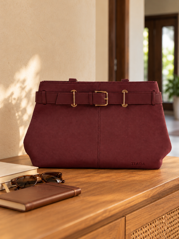 Nuvaara women's belted wine red textured vegan leather shoulder tote bag featuring front belt detail with polished gold buckle and tall shoulder handles