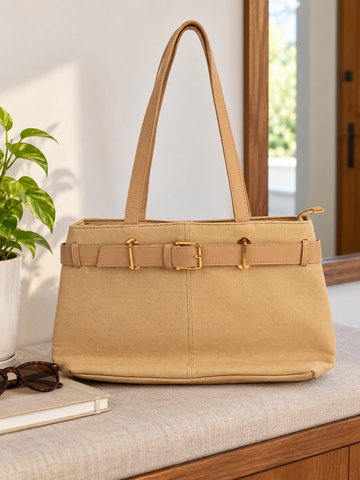 Nuvaara women's belted warm beige textured canvas and vegan leather shoulder tote bag featuring front belt detail with polished gold buckle and tall shoulder handles