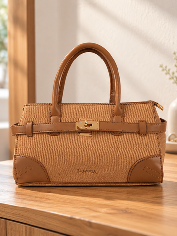 Nuvaara women's East-West structured warm tan twill satchel handbag with smooth vegan leather trim, front belt strap, and gold turn-lock plate