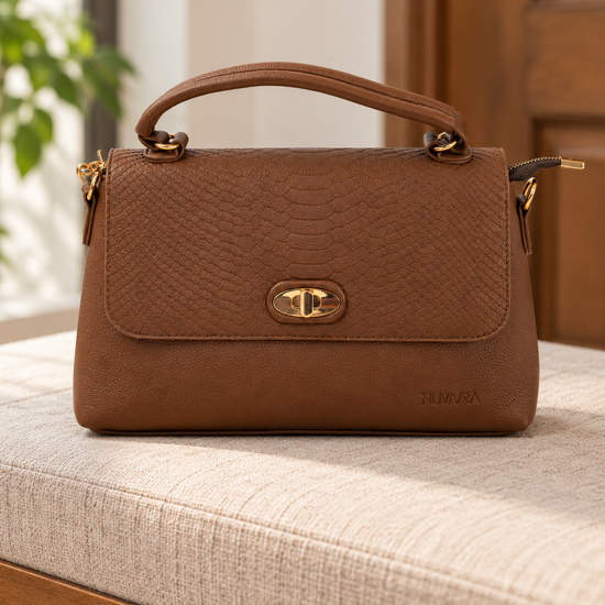 Nuvaara women's structured cognac brown shoulder bag featuring snake-embossed front flap, gold oval turn-lock clasp, arched top handle, and crossbody strap