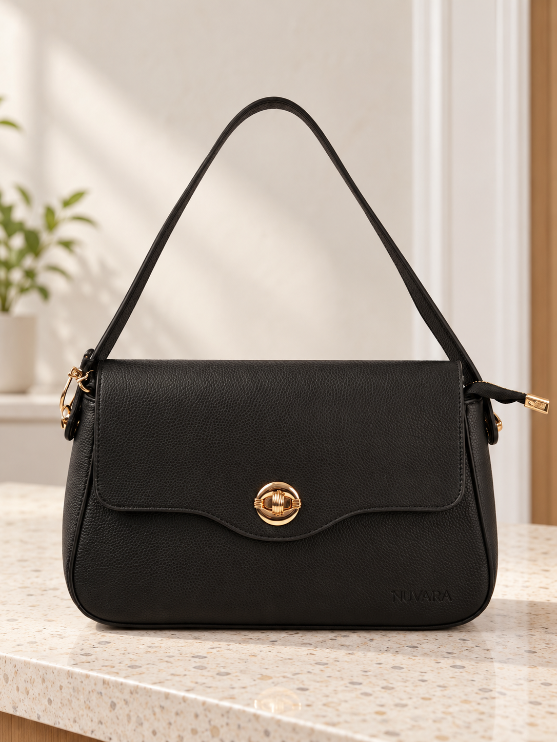 Nuvaara women's classic black pebbled vegan leather shoulder bag featuring a contoured scalloped front flap and ribbed circular gold turn-lock clasp