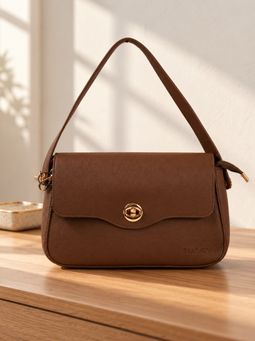 Nuvaara women's cognac brown pebbled vegan leather shoulder bag featuring a contoured scalloped front flap and ribbed circular gold turn-lock clasp