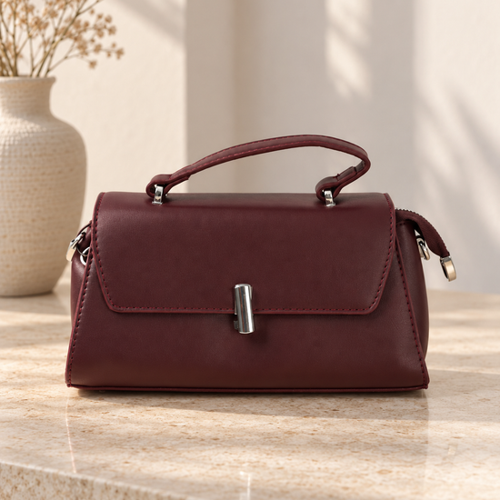 Nuvaara women's structured wine burgundy vegan leather top-handle handbag featuring a sleek front flap and vertical cylindrical silver-tone turn-lock clasp