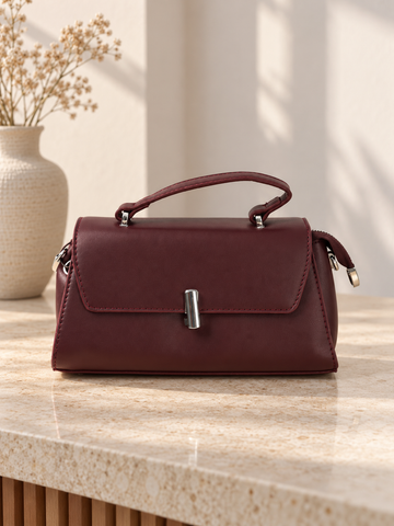 Nuvaara women's structured wine burgundy vegan leather top-handle handbag featuring a sleek front flap and vertical cylindrical silver-tone turn-lock clasp