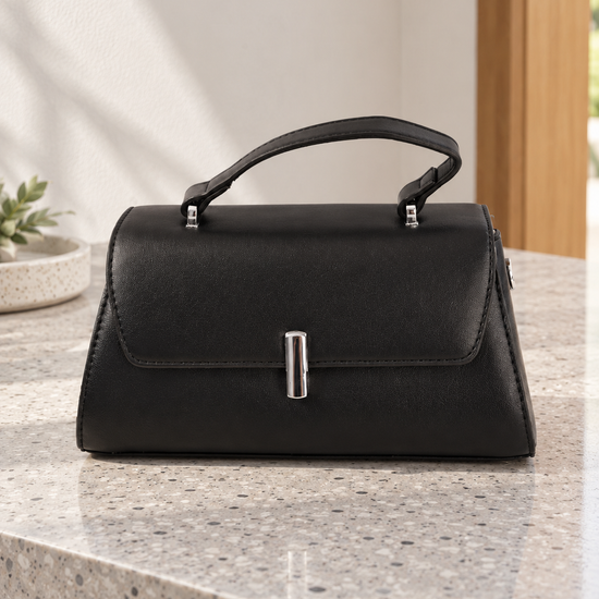 Nuvaara women's structured midnight black vegan leather top-handle handbag featuring a sleek front flap and vertical cylindrical silver-tone turn-lock clasp