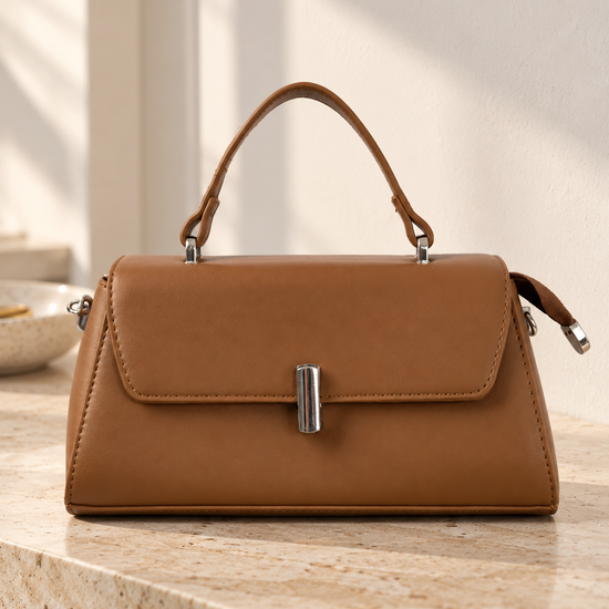 Nuvaara women's structured cognac brown vegan leather top-handle handbag featuring a sleek front flap and vertical cylindrical silver-tone turn-lock clasp