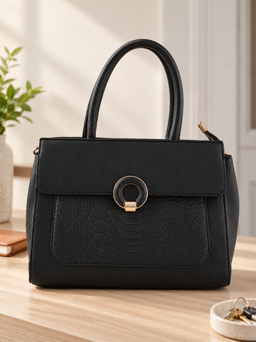 Nuvaara women's midnight black structured satchel handbag featuring an embossed snakeskin front panel, gold ring buckle clasp, and tall rolled top handles