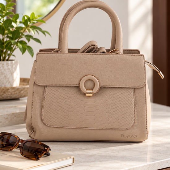 Nuvaara women's sand beige structured satchel handbag featuring an embossed snakeskin front panel, gold ring buckle clasp, and tall rolled top handles