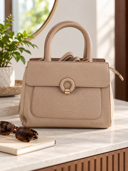 Nuvaara women's sand beige structured satchel handbag featuring an embossed snakeskin front panel, gold ring buckle clasp, and tall rolled top handles