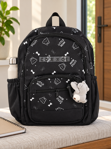 Thilakma Little Bear printed classic black nylon school backpack with white teddy bear motifs, front organizer pocket, and hanging plush bear charm keychain