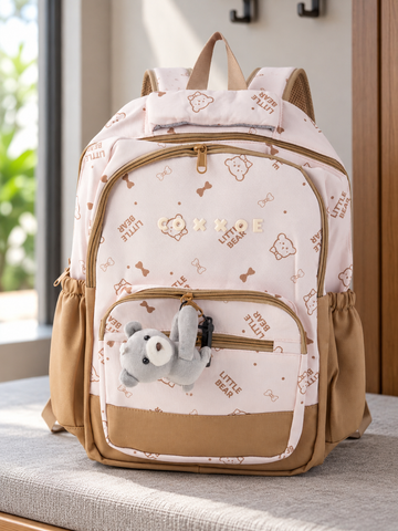 Thilakma Little Bear printed blush pink nylon school backpack with white teddy bear motifs, front organizer pocket, and hanging plush bear charm keychain