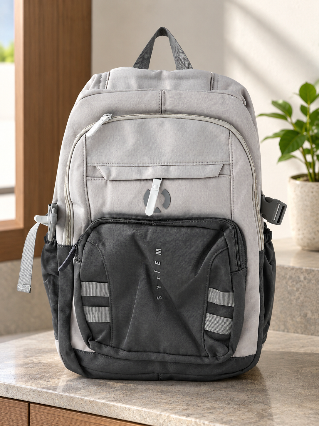 Thilakma tactical system multi-pocket cool grey and dark charcoal laptop backpack with vertical SYSTEM branding and side compression clips