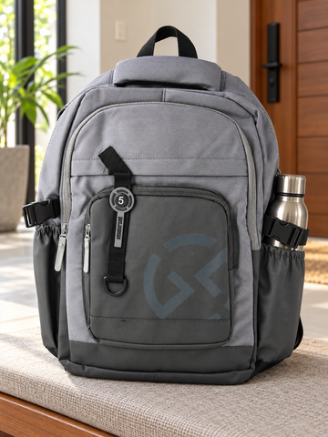 Thilakma BNT Design techwear multi-pocket dove grey and charcoal laptop backpack with geometric logo and BNT DESIGN number 5 tactical strap badge
