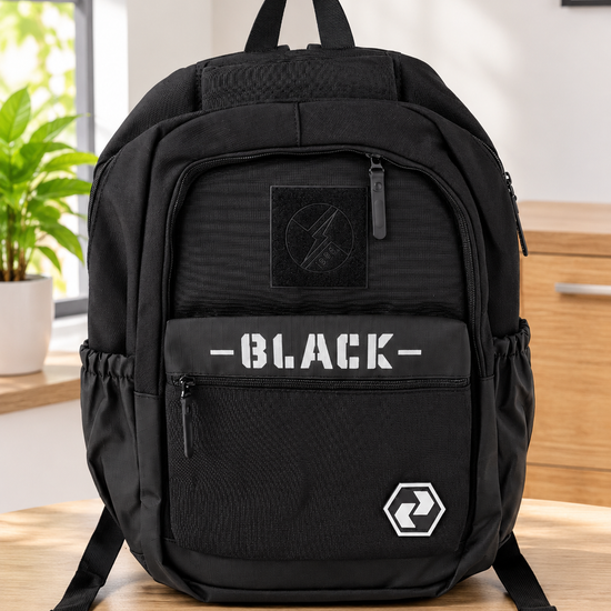 Thilakma urban graphic multi-pocket jet black school backpack with lightning bolt circular patch, bold stencil BLACK lettering, and hexagonal badge