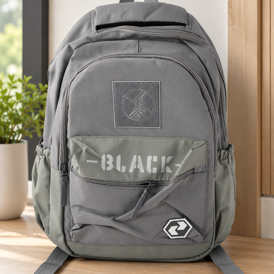 Thilakma urban graphic multi-pocket slate grey and olive school backpack with lightning bolt patch, stencil BLACK lettering, and hexagonal badge