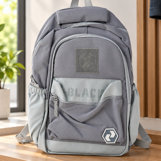 Thilakma urban graphic multi-pocket ash grey and mist blue school backpack with lightning bolt patch, stencil BLACK lettering, and hexagonal badge