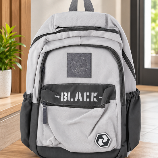 Modern multi-compartment grey and charcoal school backpack with BLACK stencil strap and lightning bolt emblem