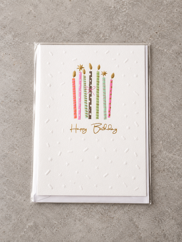 Embossed Happy Birthday greeting card featuring colourful patterned birthday candles tied with a pink bow and gold foil flames