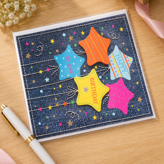 Square denim themed birthday card with stitched border and five colorful star balloons