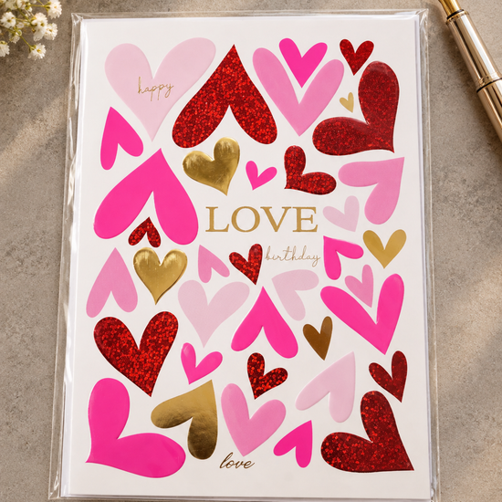 Vibrant fuchsia pink, red glitter, and gold foil graphic hearts greeting card with LOVE birthday lettering