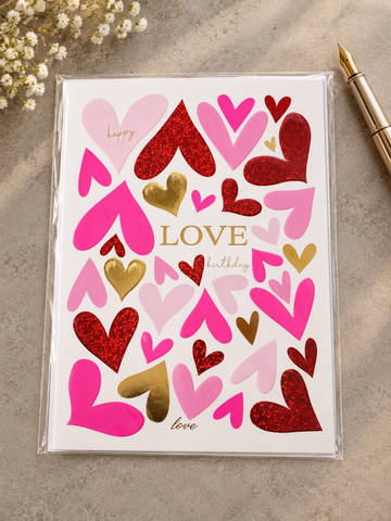 Vibrant fuchsia pink, red glitter, and gold foil graphic hearts greeting card with LOVE birthday lettering