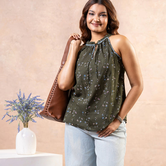 Cinnamon Isle women's olive green halter sleeveless blouse with ditsy floral print and front tie