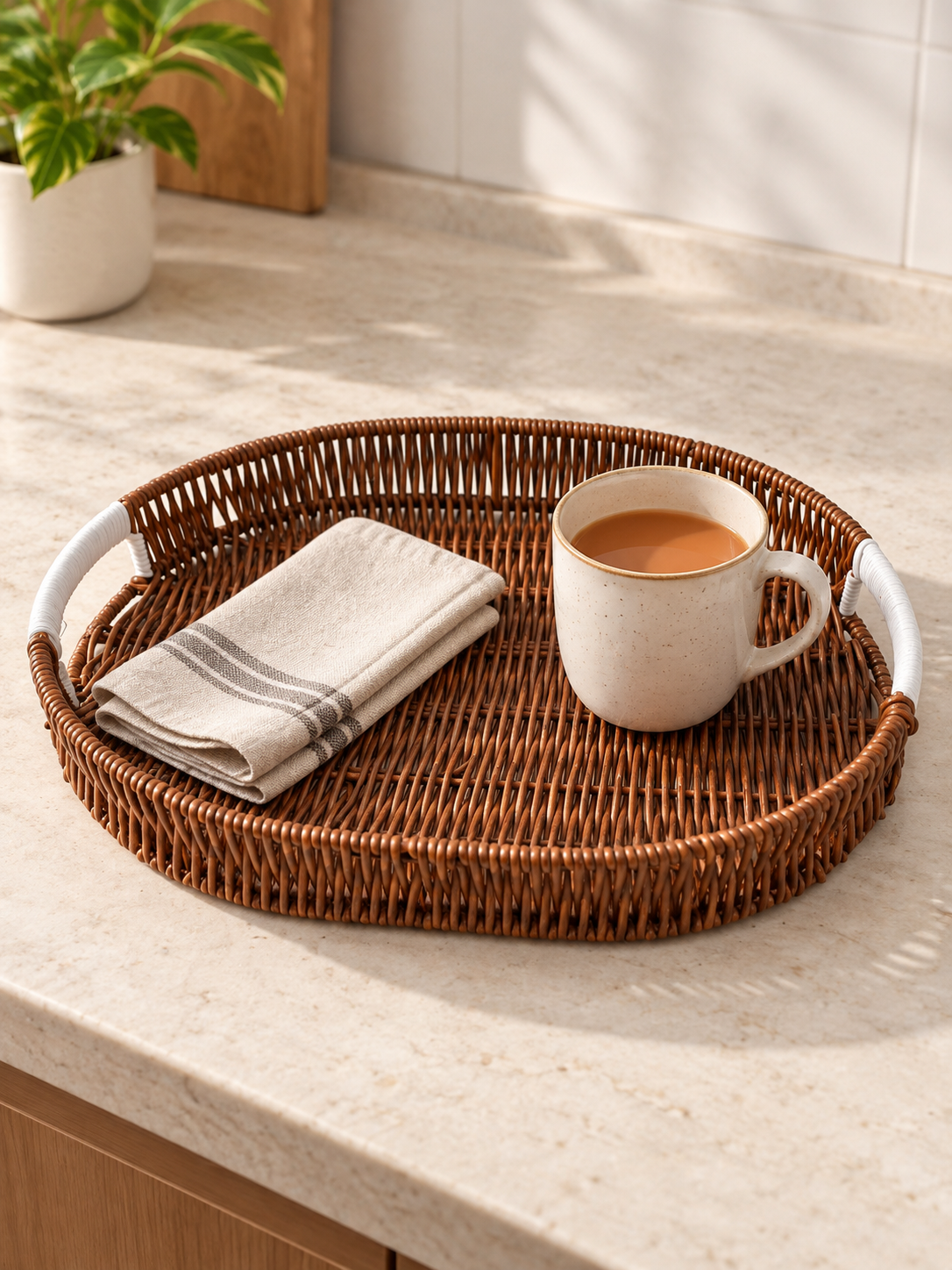 Large Mocha Brown Woven Oval Serving Tray with White Cord-Wrapped Handles Holding Milk Tea Mug and Cloth Napkin