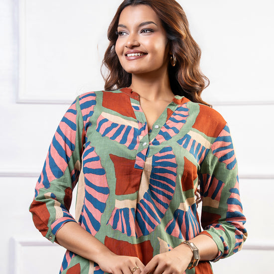 Cinnamon Isle women's olive green and terracotta mosaic print tunic dress with 3/4 sleeves and collar