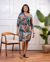 Detail shot of Cinnamon Isle teal blue tunic dress showing button placket and notched neckline