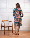 Side view of Cinnamon Isle teal blue mosaic pattern tunic dress