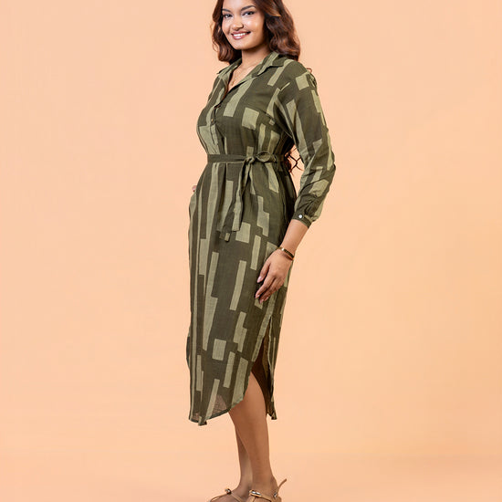 Cinnamon Isle Women's Olive Green Domino Print Belted Shirt Dress full length view showing curved hem and side slit