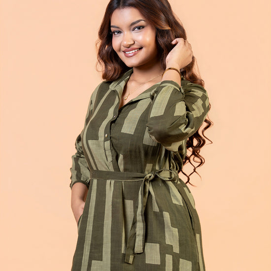 Cinnamon Isle Women's Olive Green Domino Print Belted Shirt Dress front view featuring spread collar and waist tie