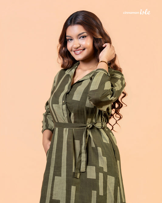 Cinnamon Isle Women's Olive Green Domino Print Belted Shirt Dress front view featuring spread collar and waist tie