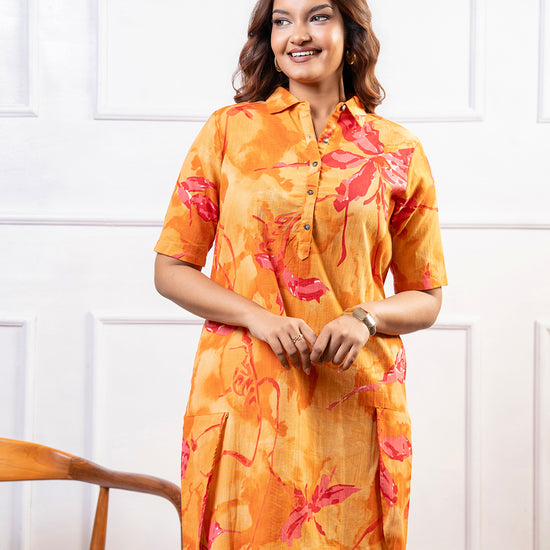 Cinnamon Isle Women's Sunset Orange Tropical Print Shirt Dress front view showing spread collar and patch pockets
