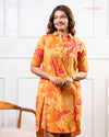 Cinnamon Isle Women's Sunset Orange Tropical Print Shirt Dress front view showing spread collar and patch pockets