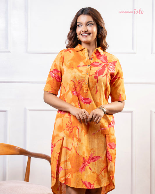 Cinnamon Isle Women's Sunset Orange Tropical Print Shirt Dress front view showing spread collar and patch pockets