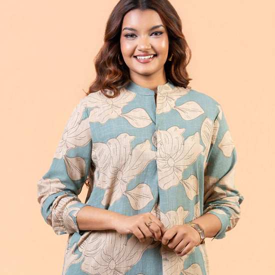 Cinnamon Isle Women's Slate Blue Leaf Print Curved Hem Tunic Dress close-up portrait showing mandarin collar