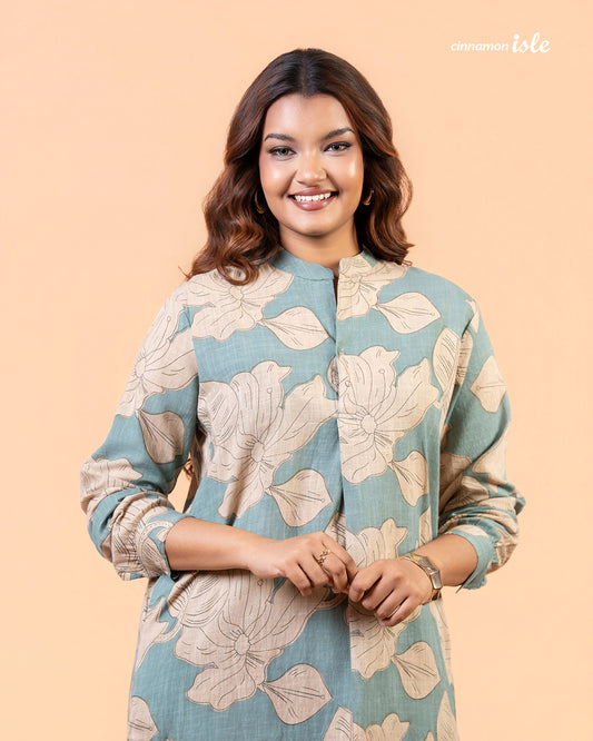 Cinnamon Isle Women's Slate Blue Leaf Print Curved Hem Tunic Dress close-up portrait showing mandarin collar